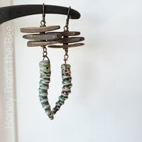 Green and brown earrings with quirky character