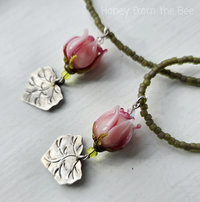 Pink rosebud necklace with Thai silver leaf dangle