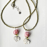 Lampwork necklace features pink rosebud and Thai silver leaf