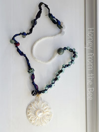 Boho style necklace in white, blue and teal