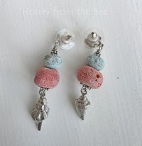 Coral and turquoise earrings feature lampwork and pewter charms
