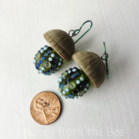 Mushroom shaped earrings feature lampwork in aqua and green