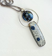 Blue and silver pendant features K2 granite cabochon
