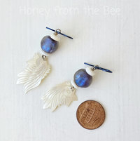 Koi earrings feature mother of pearl and lampwork glass