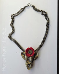 One of a kind necklace features red poppy