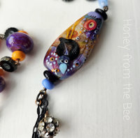 Lampwork necklace in purple, blue and orange