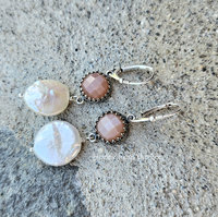 Iridescent coin pearls dangle from shimmering peach moonstones in these feminine earrings