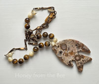 Art necklace features ocean jasper, tiger eye and mother of pearl