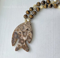 Fish necklace features ocean jasper and tiger eye in browns and white