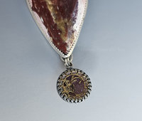 Antique mirror button in red and gold is set in sterling silver to be a dangle in this one of a kind artisan necklace.