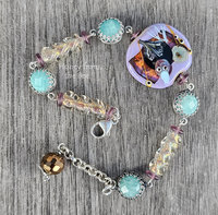 Lavender, green, and orange bead bracelet