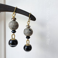 Dangle earrings in black and gold sparkle with crystals