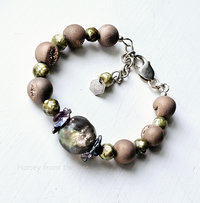 Pink and green bracelet features basha bead and pearls