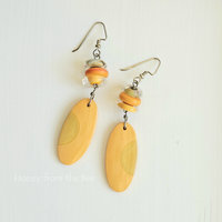 Artisan earrings in shades of orange