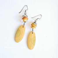 Orange lampwork earrings in discs and ovals