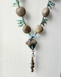 Beach necklace features tagua nuts and lampwork