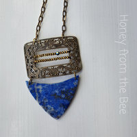 One of a kind statement necklace in gold and blue