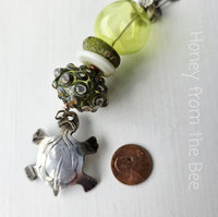 Turtle pendant with green lampwork artisan necklace