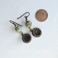 Antique brass button earrings with soft green ceramic beads