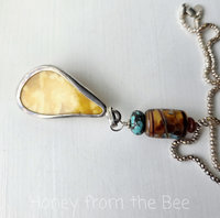 back of vintage amber pendant