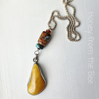 Summer pendant features vintage amber, lampwork and turquoise
