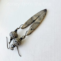 Long dangle earrings in black and tan