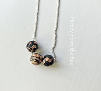 Three bead necklace in sterling silver with pink and black gemstone beads