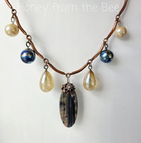 Artisan necklace in copper, blue and yellow