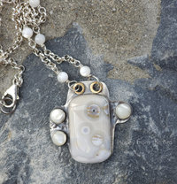 Rare ocean jasper set in sterling silver with mother of pearl cabochons