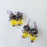Joyful earrings in yellow and purple feature lampwork glass
