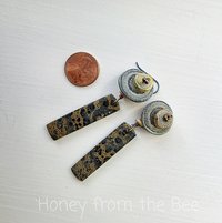 Beach inspired earrings feature lampwork and stones in grey blue and sand tones