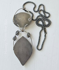 Photo shows back of sterling silver gemstone pendant