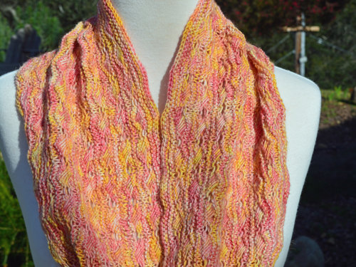 Yellow and pink knitted cowl