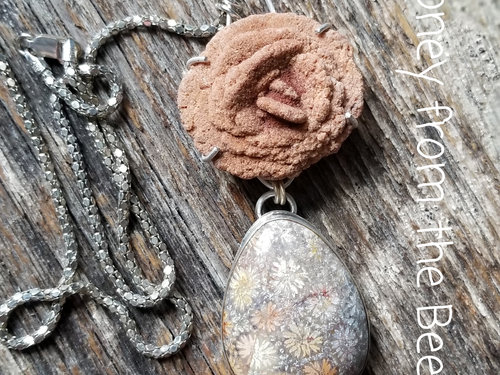 Orange and grey necklace comprised of fossilized coral agate, byrite rose, and sterling silver.