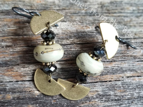 Gold and black dangle earrings