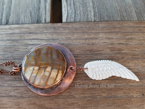 petrified wood cabochon set in copper pendant