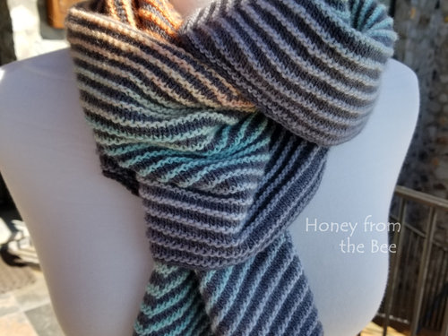 Teal and orange hand-knit shawl