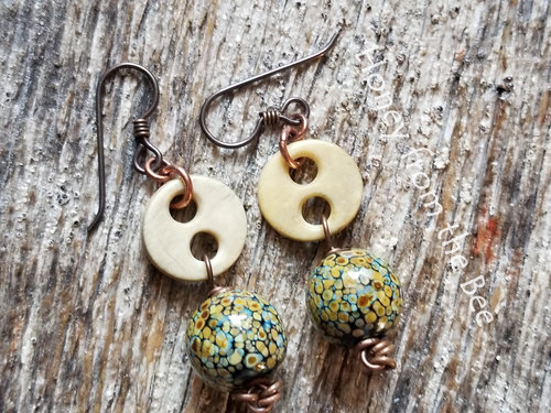 Vintage button earrings make this pair a unique find.