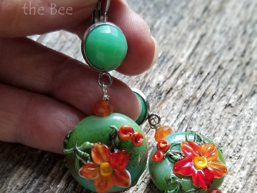 Green and orange artisan earrings