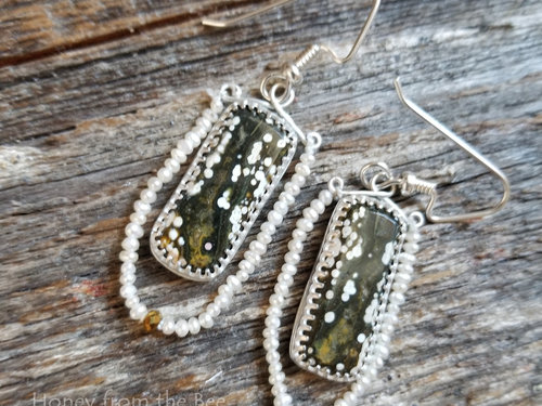 Green and white artisan earrings