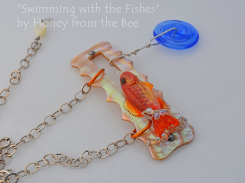 Orange lampwork fish and Mother of Pearl necklace