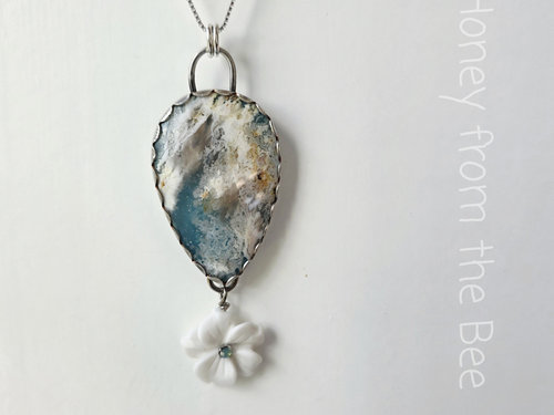 Blue and white gemstone pendant