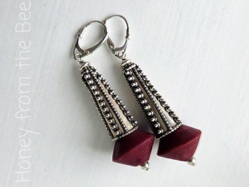 Sterling silver earrings with dark red bead