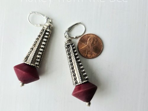 Statement earrings in dark red and silver