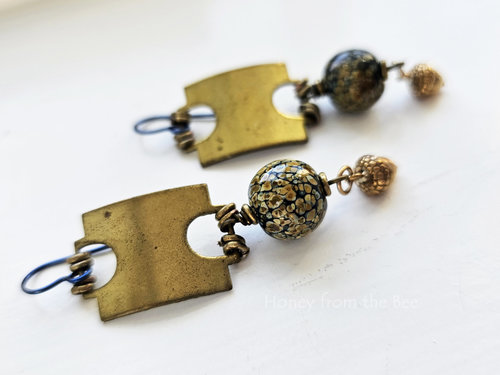 Brass and art glass earrings feature vintage brass tag with raku frit lampwork bead and a detailed brass acorn dangle.