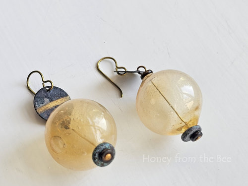 Turquoise beads finish off these yellow boho earrings