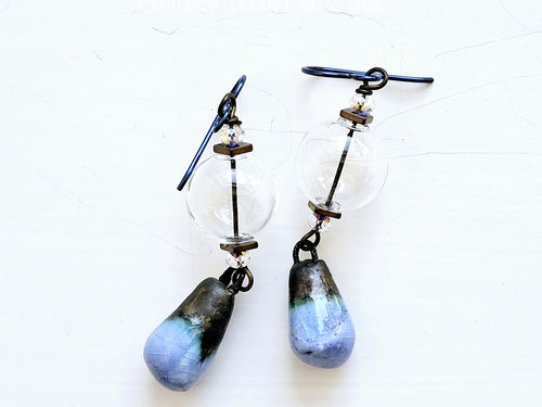 Crystal and ceramic earrings in blue and clear