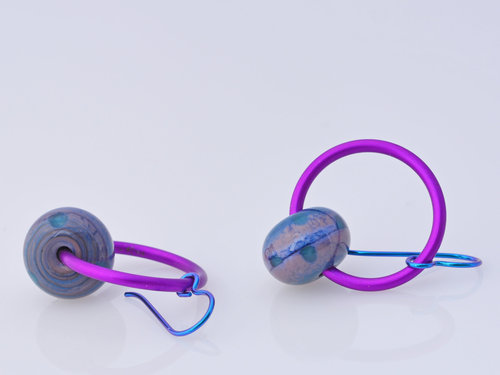 Bright berry colored earrings in teal and purple