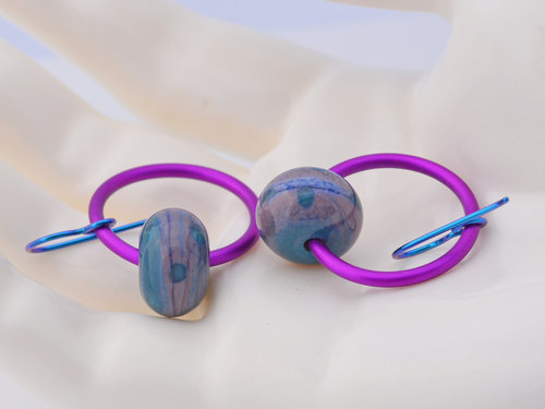 Hoops in fucshia hold lampwork of teal and purple in this pair of artisan earrings