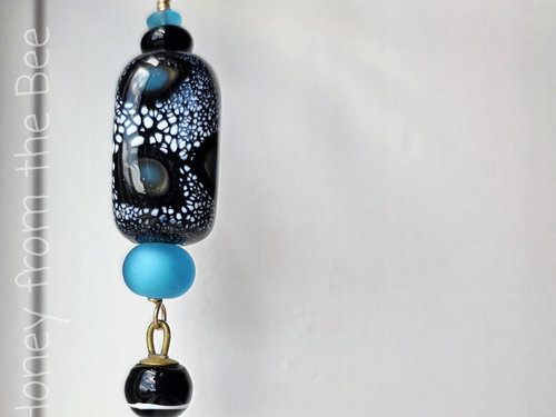 Lampwork pendant in blue and black with antique button